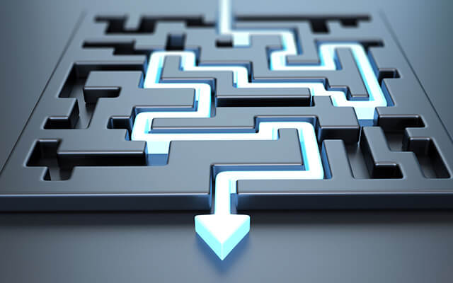 An arrow solving a maze similar to how custom software development solutions solve complex problems